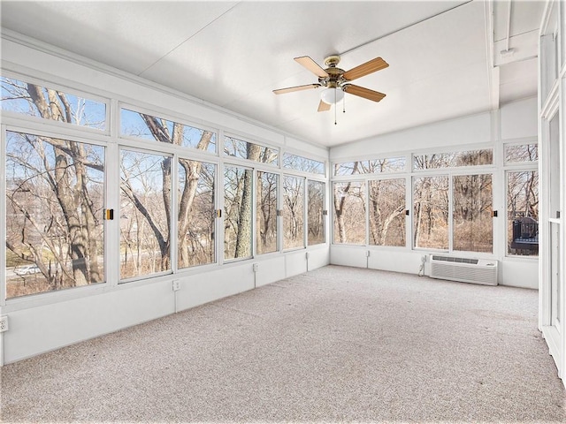 unfurnished sunroom with a ceiling fan and a wall unit AC