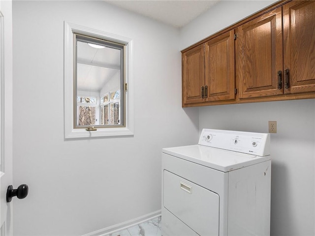 clothes washing area with cabinet space, washer / clothes dryer, marble finish floor, and baseboards