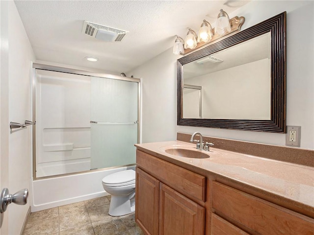 bathroom with vanity, visible vents, a textured ceiling, bathing tub / shower combination, and toilet