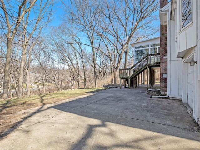 exterior space with stairway and driveway