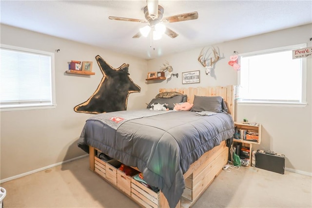 bedroom with carpet, baseboards, and ceiling fan