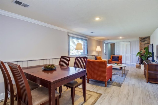 dining room featuring light wood finished floors, visible vents, recessed lighting, and ornamental molding