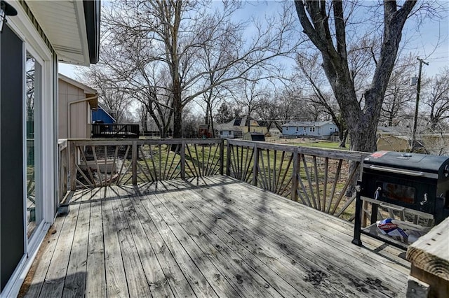 wooden deck featuring a residential view