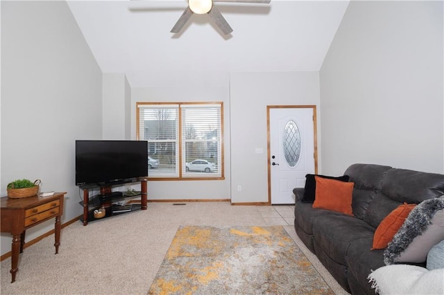 carpeted living area with baseboards, a ceiling fan, and vaulted ceiling