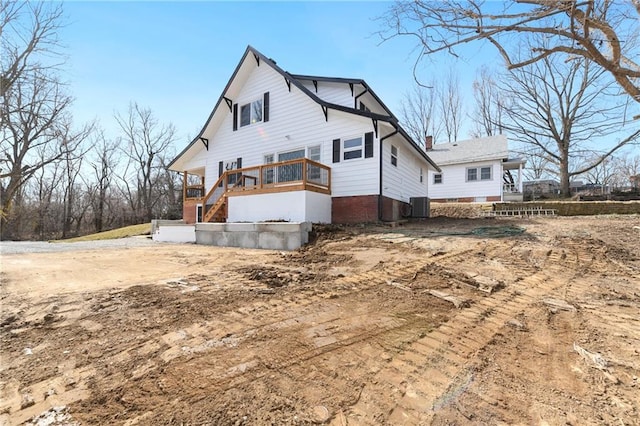 rear view of property featuring cooling unit