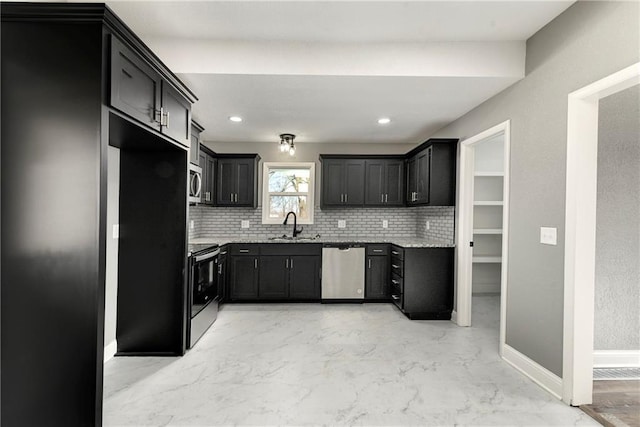 kitchen with light stone countertops, marble finish floor, appliances with stainless steel finishes, and a sink