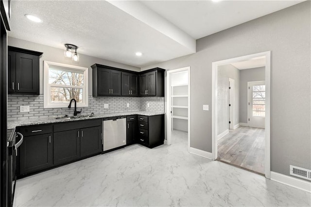 kitchen featuring marble finish floor, black electric range oven, a sink, tasteful backsplash, and stainless steel dishwasher