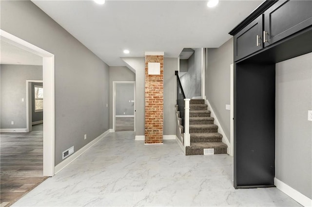 interior space with visible vents, baseboards, stairway, recessed lighting, and marble finish floor