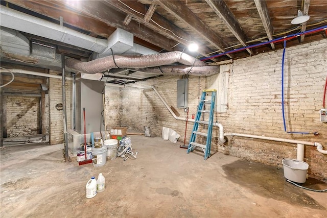 unfinished basement with electric panel and brick wall