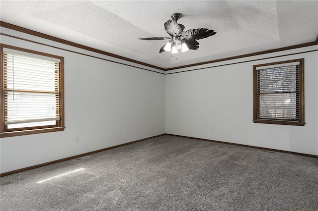 spare room featuring visible vents, a textured ceiling, ceiling fan, and carpet flooring