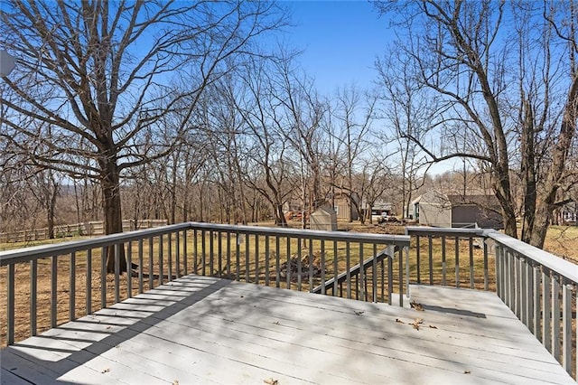 wooden terrace with an outbuilding