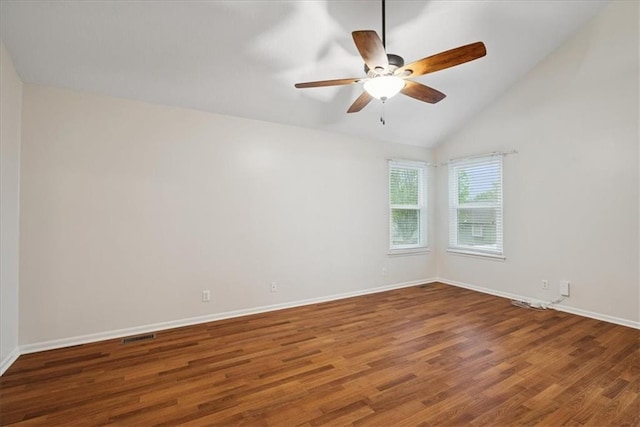 unfurnished room with a ceiling fan, baseboards, wood finished floors, lofted ceiling, and visible vents