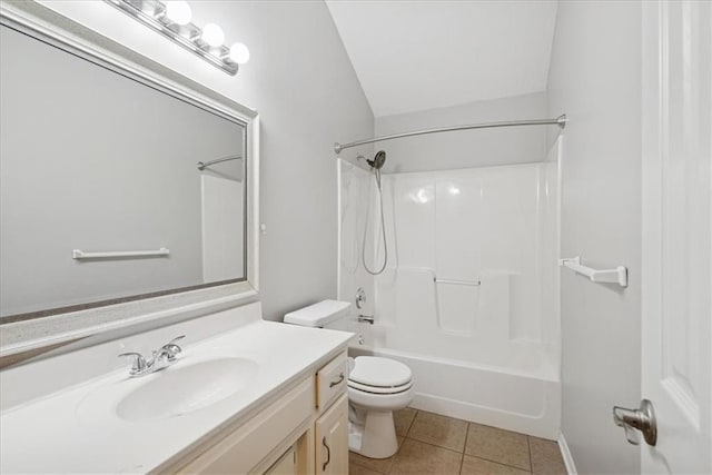 bathroom featuring tile patterned floors, vanity, toilet, and shower / washtub combination