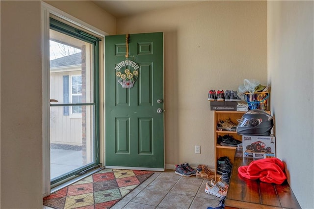 entrance foyer featuring tile patterned flooring