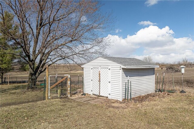 view of shed with fence