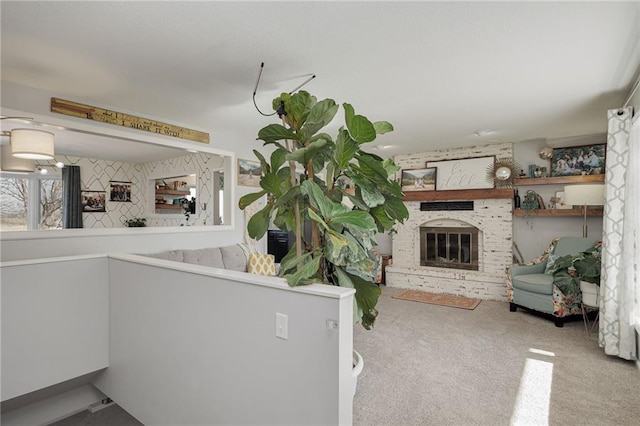 unfurnished living room with carpet floors and a fireplace