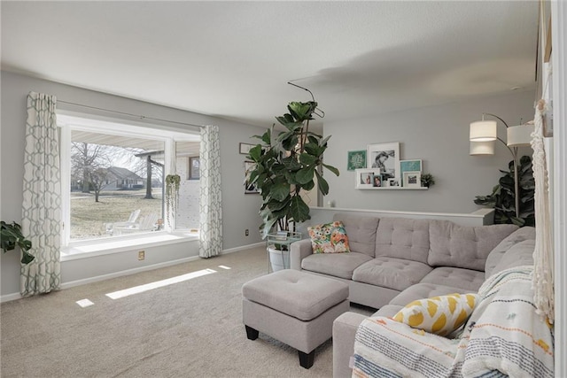 carpeted living room featuring baseboards