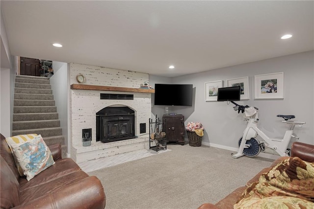 living room featuring baseboards, stairs, carpet flooring, recessed lighting, and a fireplace