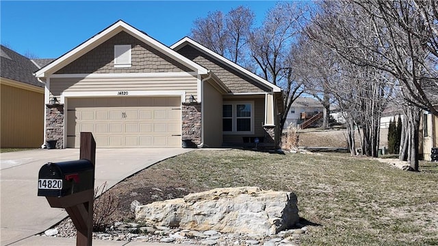 view of front of home with a garage, stone siding, and driveway