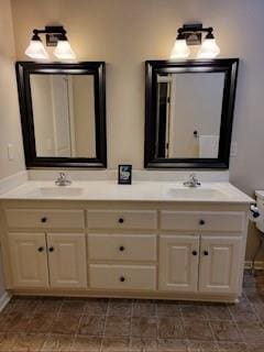 bathroom featuring double vanity and a sink