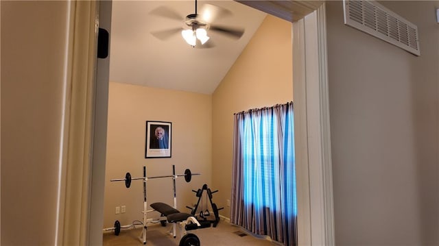 exercise room with visible vents, lofted ceiling, carpet, and a ceiling fan