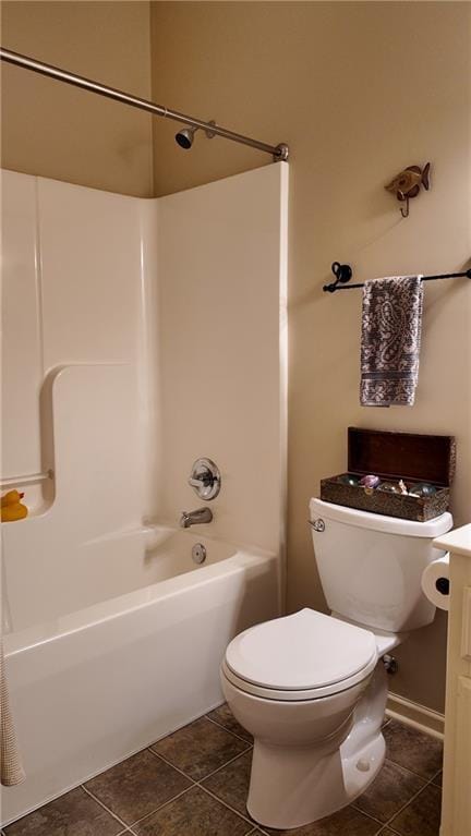 bathroom featuring tile patterned flooring, toilet, vanity, and shower / bath combination