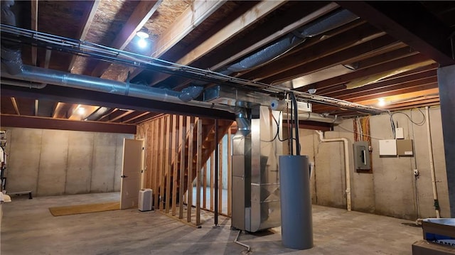 unfinished basement with electric panel, stairway, heating unit, and water heater