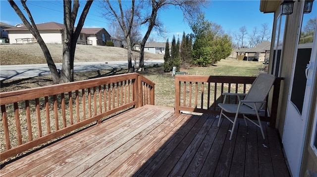 wooden terrace with a residential view