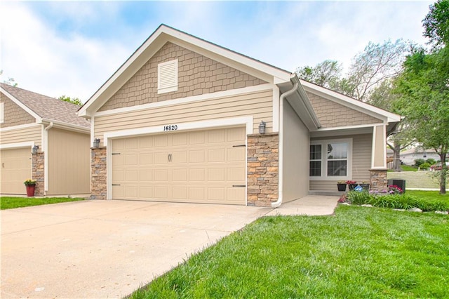 14820 Ashmont Ln, Smithville, MO 64089 - craftsman-style home with a garage, driveway, a front lawn, and stone siding