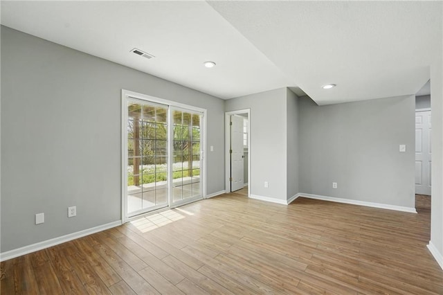 12203 E 214th Ter, Peculiar, MO 64078 - empty room featuring baseboards, light wood-style floors, and recessed lighting