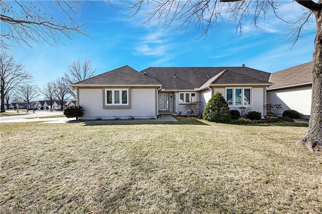 view of front of property featuring a front yard and stucco siding