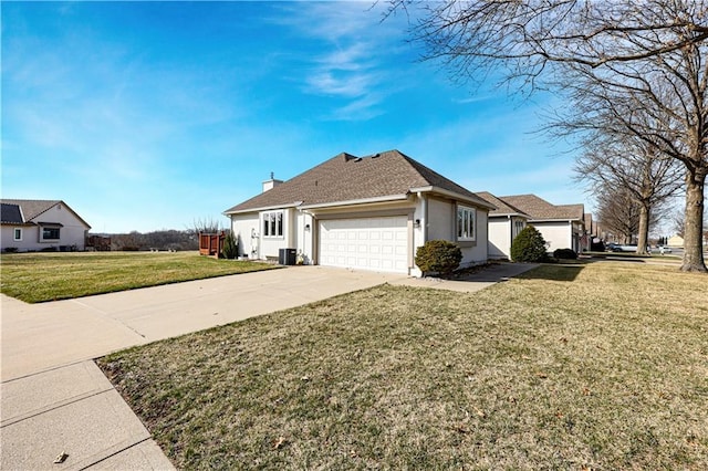 view of front facade featuring a front lawn, concrete driveway, stucco siding, a chimney, and an attached garage