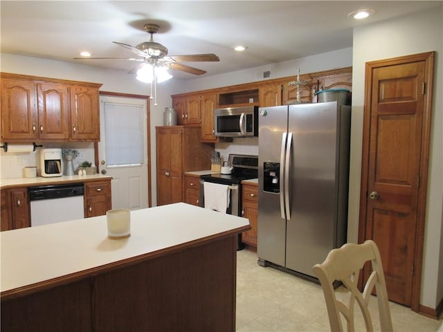 kitchen with recessed lighting, appliances with stainless steel finishes, and light countertops