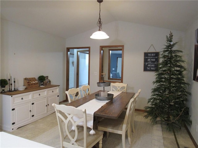 dining room with lofted ceiling