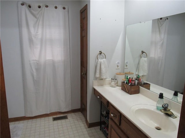 full bathroom with tile patterned floors, visible vents, baseboards, and vanity