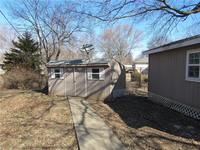 view of side of home with an outbuilding