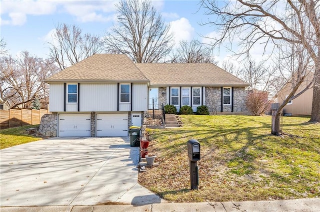 view of front of property with concrete driveway, a garage, stone siding, and a front lawn