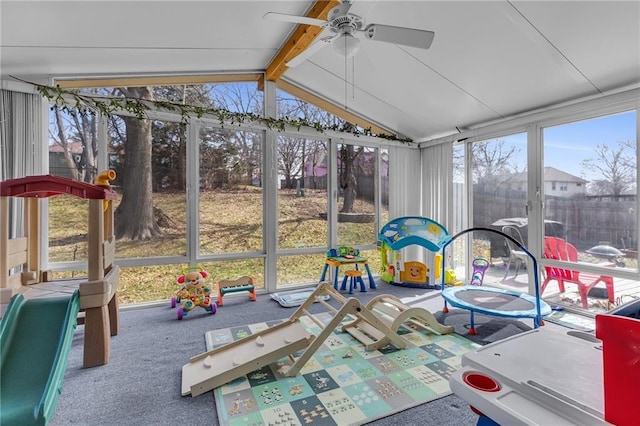 sunroom / solarium with lofted ceiling with beams and a ceiling fan