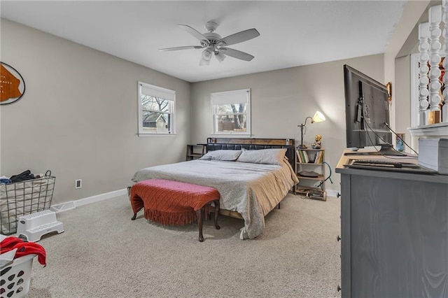 carpeted bedroom with baseboards and ceiling fan