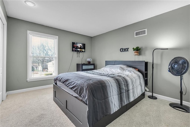 bedroom with visible vents, carpet flooring, and baseboards