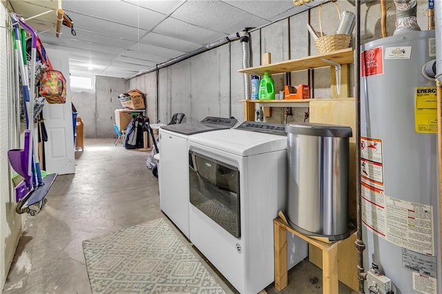 laundry area featuring separate washer and dryer, water heater, and laundry area