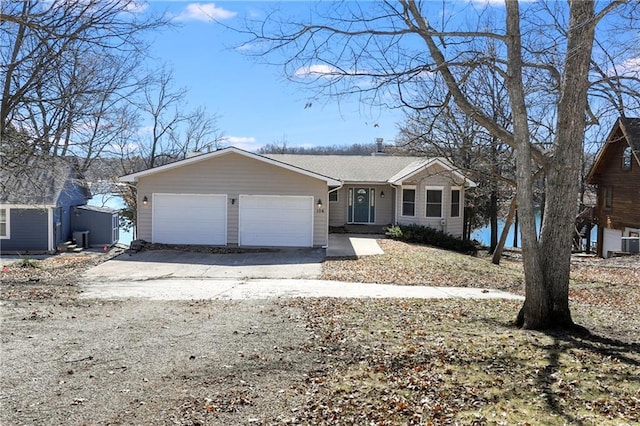 view of front of home with a garage and driveway