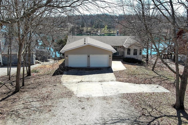 view of front of home featuring an attached garage and driveway