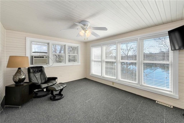 sunroom / solarium featuring visible vents, cooling unit, wood ceiling, and ceiling fan