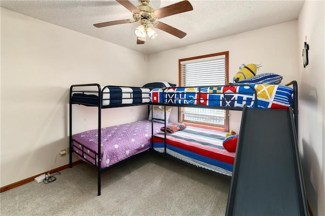 bedroom with carpet flooring, ceiling fan, a textured ceiling, and baseboards