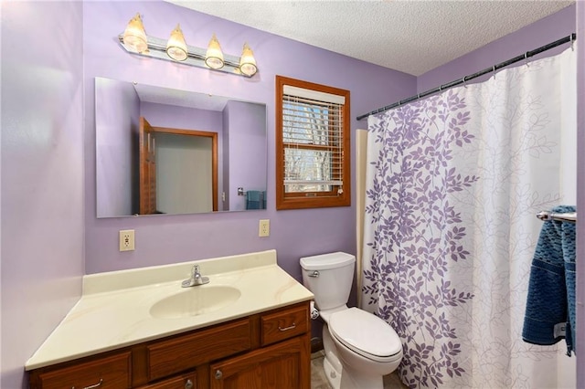 bathroom with curtained shower, a textured ceiling, vanity, and toilet