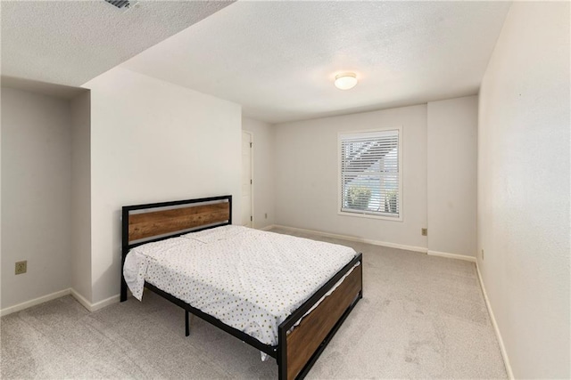 106 Timber Valley Dr, Linn Valley, KS 66040 - bedroom with a textured ceiling, light colored carpet, and baseboards