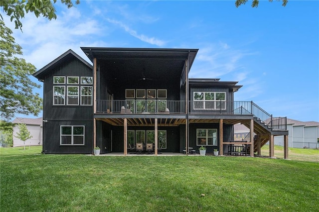 21143 W 189th Ct, Spring Hill, KS 66083 - rear view of property featuring stairs, a wooden deck, and a lawn
