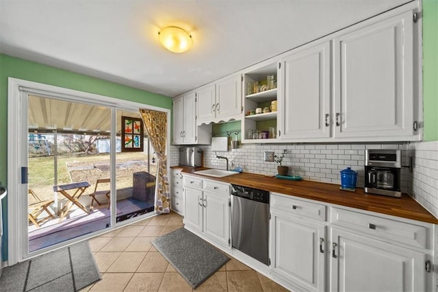 kitchen featuring a sink, dishwasher, white cabinetry, wood counters, and open shelves