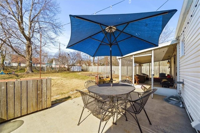 view of patio featuring outdoor dining space and a fenced backyard